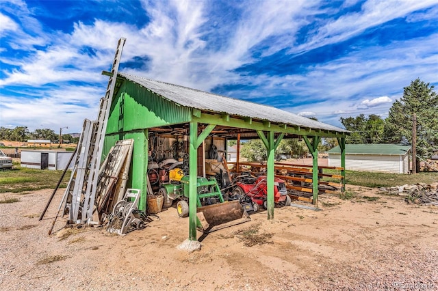 view of playground featuring an outbuilding