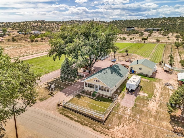 birds eye view of property featuring a rural view