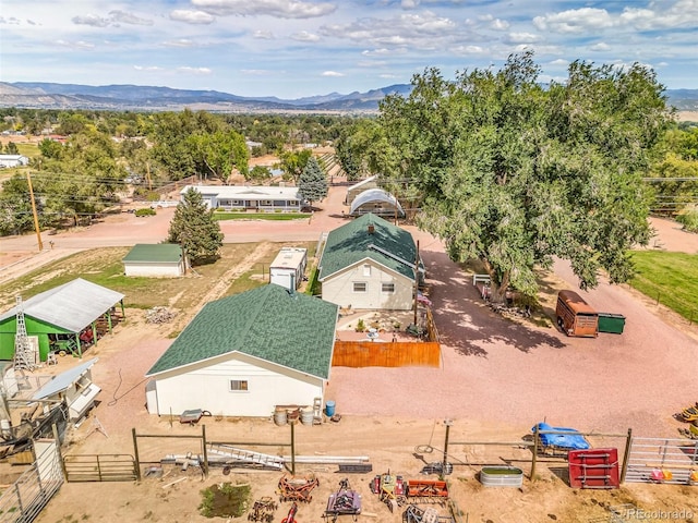 birds eye view of property featuring a mountain view