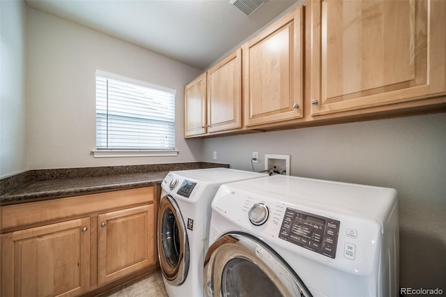 laundry room with cabinet space and washer and dryer