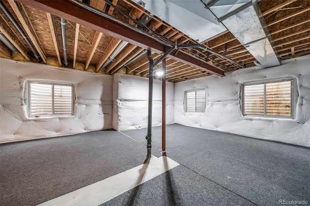 basement featuring carpet and healthy amount of natural light