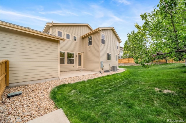 rear view of house with a patio area and central air condition unit