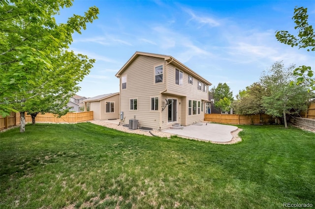 rear view of property featuring a patio and central air condition unit