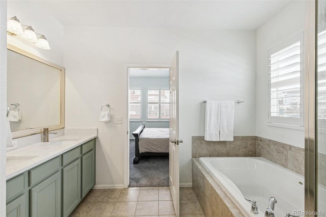 bathroom with vanity, tiled bath, and tile patterned floors