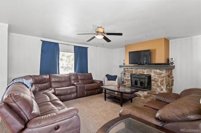 living area with carpet floors and a ceiling fan