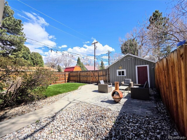 313 W Arkansas St, Buena Vista, CO 81211 - view of patio / terrace featuring a fenced backyard and an outbuilding