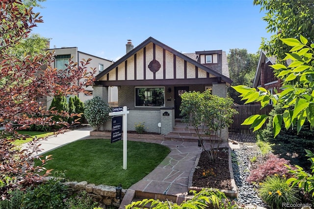 815 S Gaylord St, Denver, CO 80209 - english style home featuring brick siding and covered porch