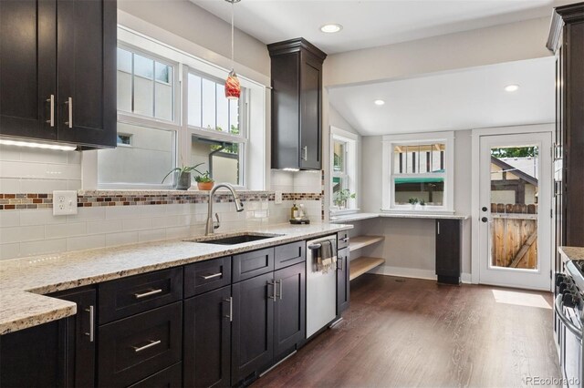 815 S Gaylord St, Denver, CO 80209 - kitchen featuring dark wood finished floors, light stone countertops, backsplash, hanging light fixtures, and dishwasher