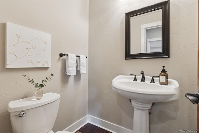 815 S Gaylord St, Denver, CO 80209 - half bathroom featuring baseboards and toilet