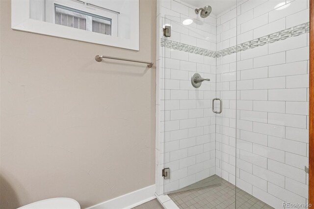815 S Gaylord St, Denver, CO 80209 - bathroom featuring a stall shower and baseboards