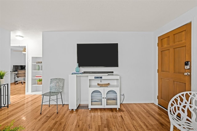 5465 Saulsbury Ct, Arvada, CO 80002 - living room with wood finished floors, ceiling fan, and built in features