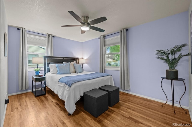 5465 Saulsbury Ct, Arvada, CO 80002 - bedroom with light wood-type flooring and ceiling fan