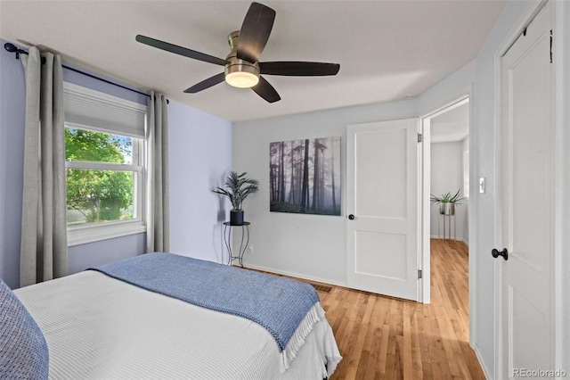 5465 Saulsbury Ct, Arvada, CO 80002 - bedroom with light wood finished floors and ceiling fan