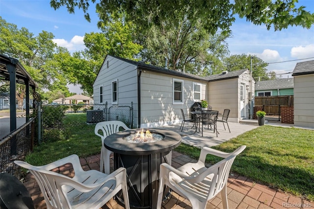 5465 Saulsbury Ct, Arvada, CO 80002 - fenced backyard with a fire pit and a patio area
