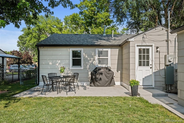 5465 Saulsbury Ct, Arvada, CO 80002 - rear view of house with a patio and a shingled roof