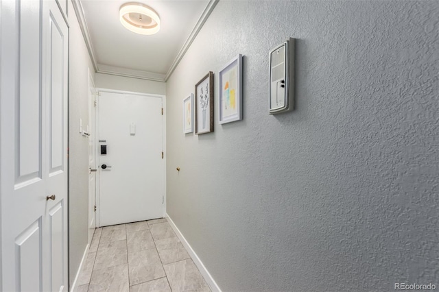 hall with crown molding and light tile floors