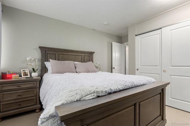 carpeted bedroom featuring a closet