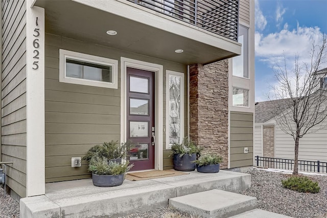 doorway to property featuring a balcony