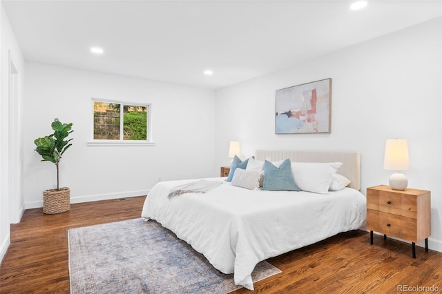 bedroom featuring dark hardwood / wood-style flooring