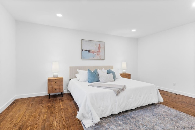 bedroom featuring dark wood-type flooring