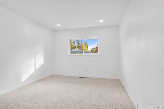 unfurnished room featuring carpet