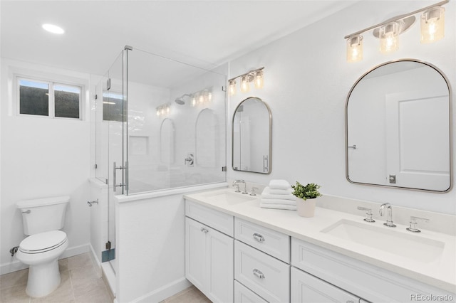 bathroom featuring vanity, a shower with shower door, tile patterned floors, and toilet