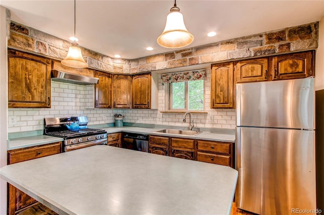 6687 Devinney Ct, Arvada, CO 80004 - kitchen featuring appliances with stainless steel finishes, exhaust hood, a sink, light countertops, and backsplash