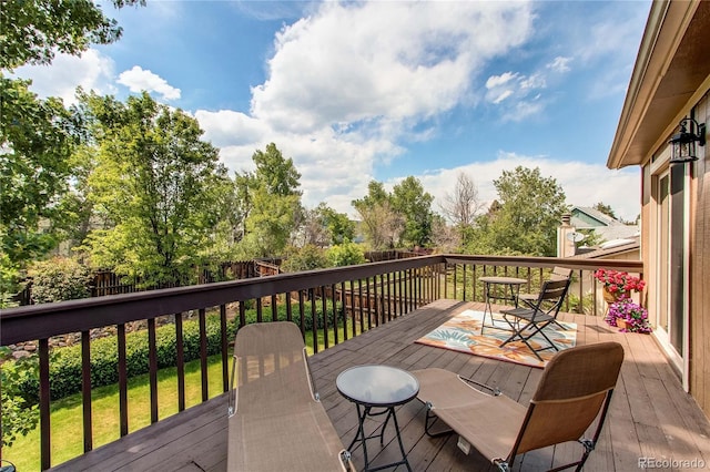 6687 Devinney Ct, Arvada, CO 80004 - wooden deck with outdoor dining area