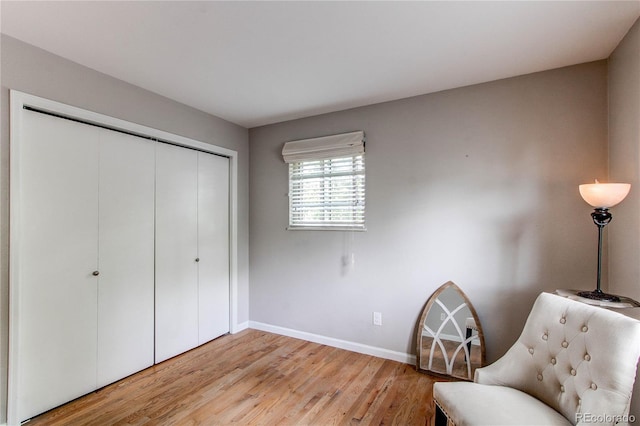 6687 Devinney Ct, Arvada, CO 80004 - living area with baseboards and light wood-style floors