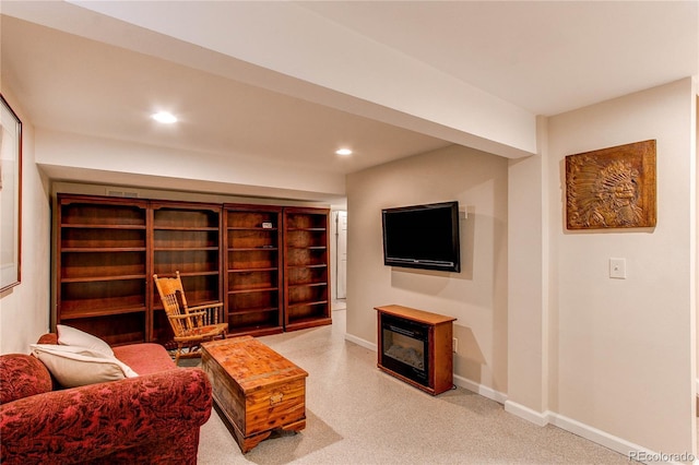 6687 Devinney Ct, Arvada, CO 80004 - living area featuring a glass covered fireplace, baseboards, and recessed lighting