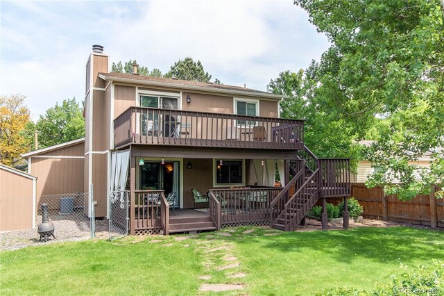 6687 Devinney Ct, Arvada, CO 80004 - rear view of property featuring a chimney, a deck, and stairs