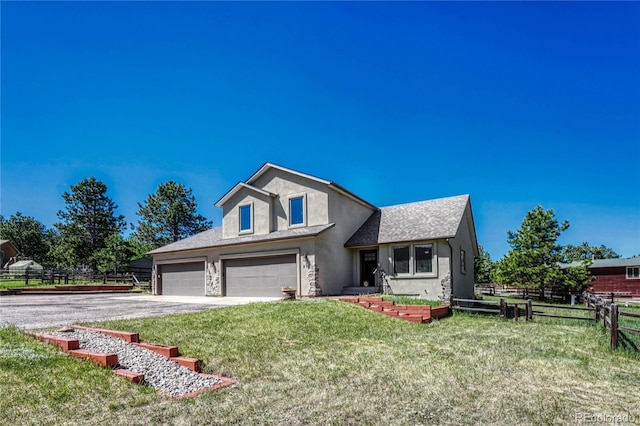 view of front of home featuring a garage and a front yard