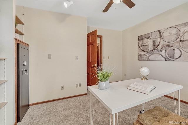 office featuring ceiling fan and light colored carpet