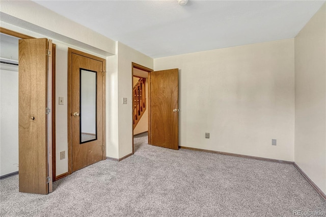 unfurnished bedroom with light carpet