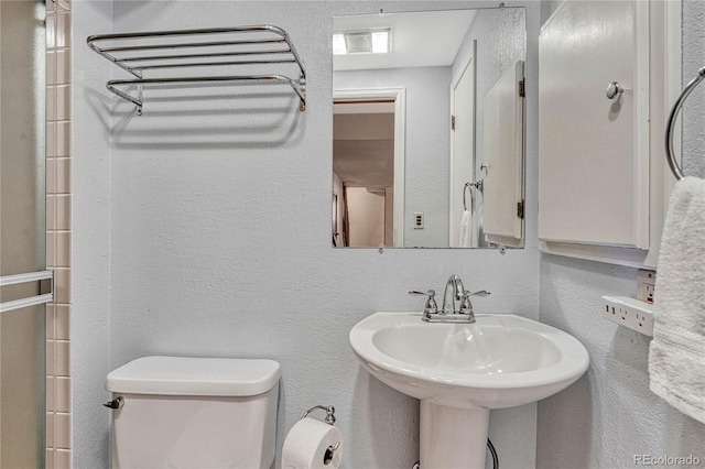 bathroom with toilet and sink