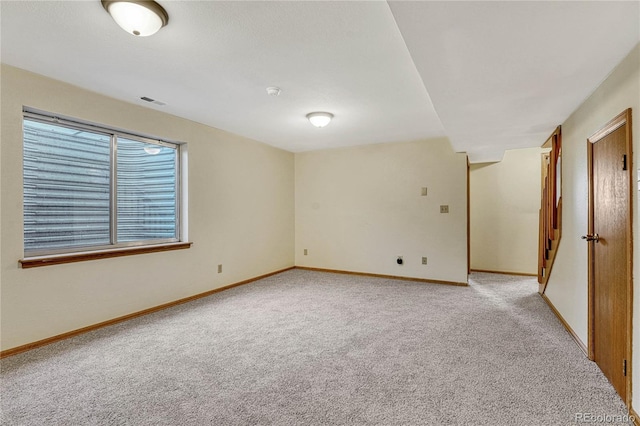 empty room featuring light carpet