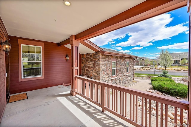 balcony featuring a residential view and covered porch