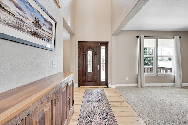 view of carpeted foyer