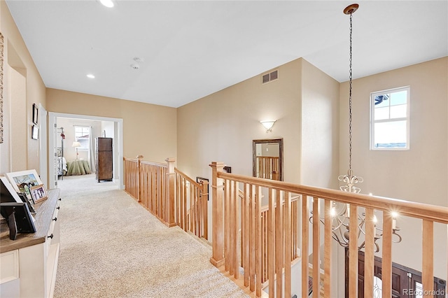 hallway featuring carpet flooring