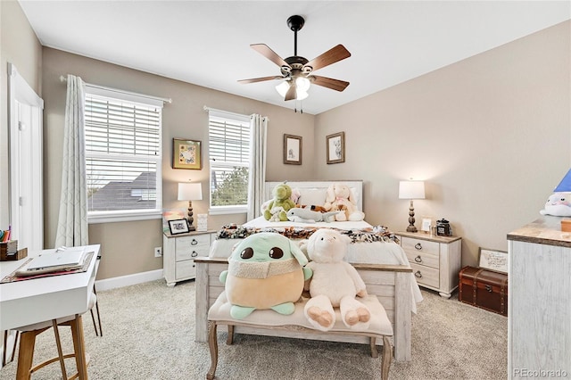 bedroom with ceiling fan and light colored carpet