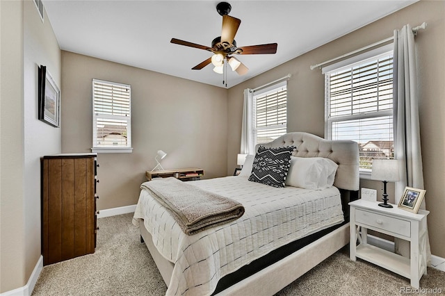 bedroom with light carpet and ceiling fan