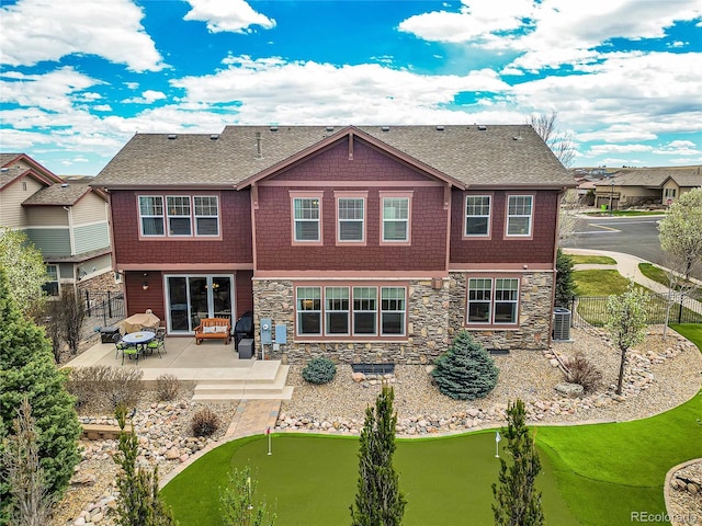 rear view of property featuring cooling unit and a patio