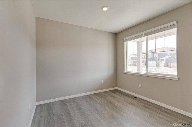 unfurnished room featuring light hardwood / wood-style flooring