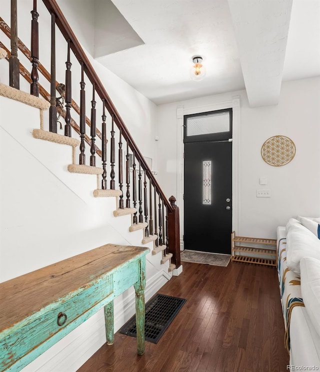 foyer with dark hardwood / wood-style floors