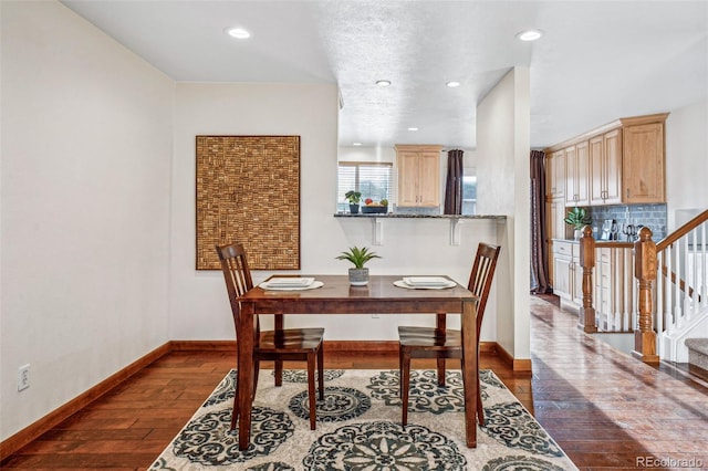 dining room featuring dark hardwood / wood-style flooring