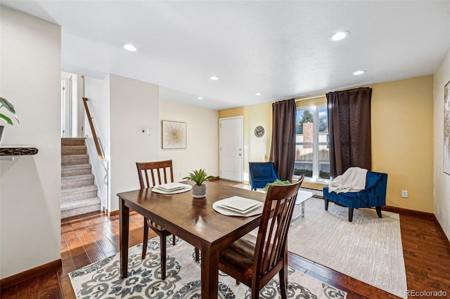 dining space with dark wood-type flooring