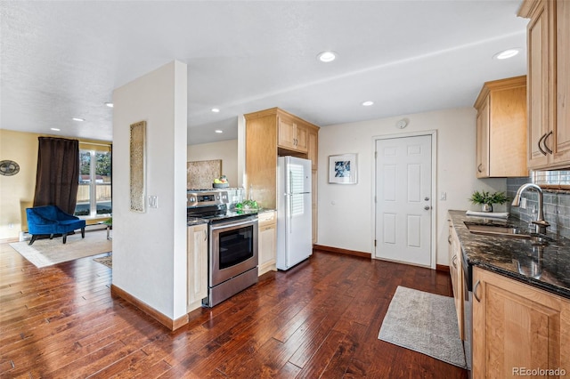 kitchen featuring light brown cabinetry, sink, stainless steel range with electric cooktop, dark hardwood / wood-style flooring, and white fridge