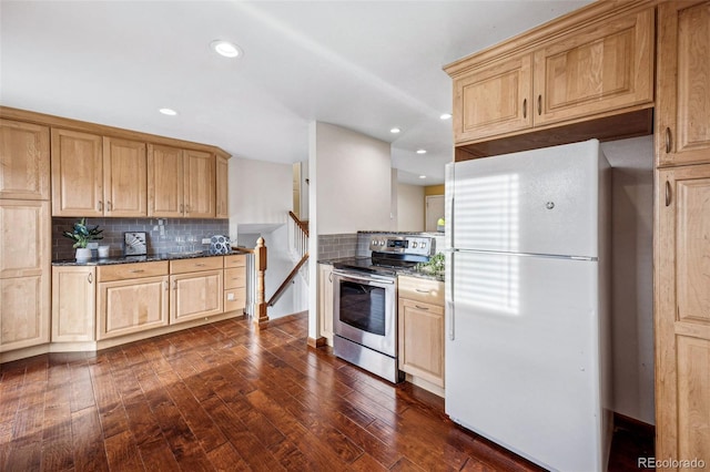 kitchen featuring backsplash, dark hardwood / wood-style floors, white refrigerator, stainless steel range with electric cooktop, and dark stone counters