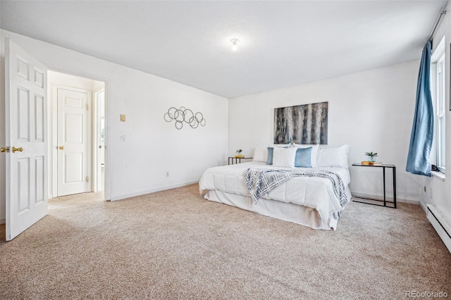 carpeted bedroom with a baseboard radiator