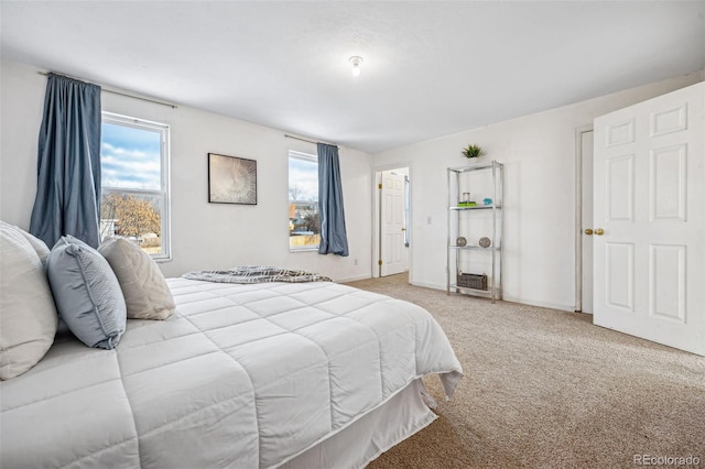 bedroom featuring light colored carpet